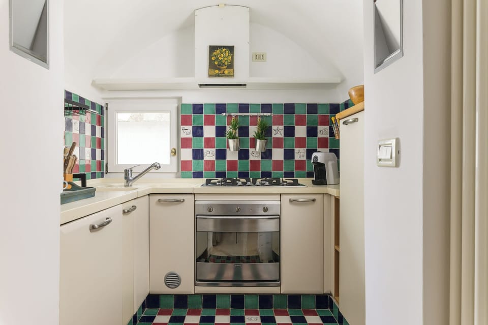 Apartment, Partial Sea View | Private kitchen | Espresso maker, electric kettle, dining tables