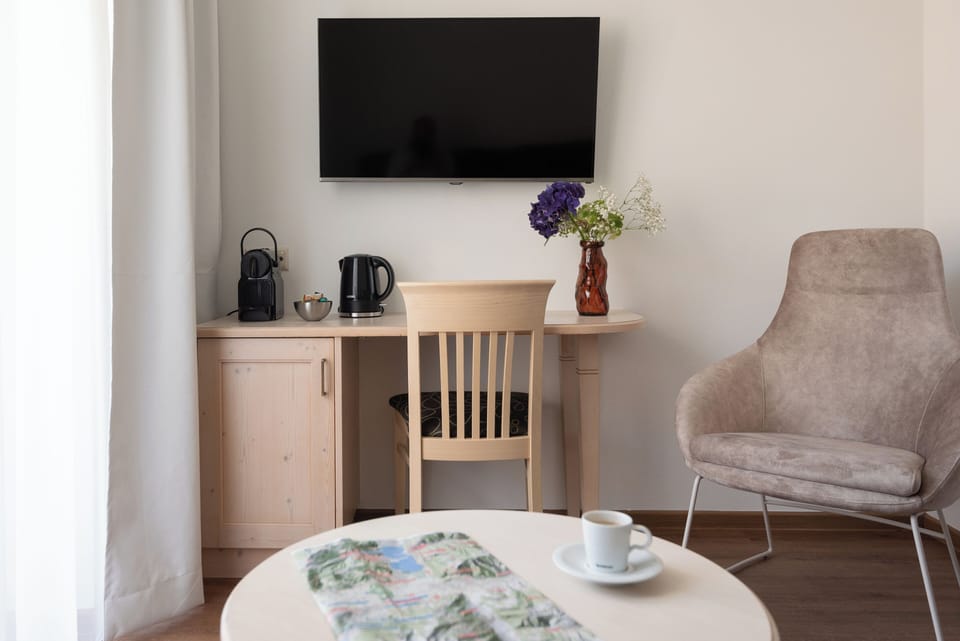 Family Room, Balcony | Living area | 32-inch flat-screen TV with cable channels