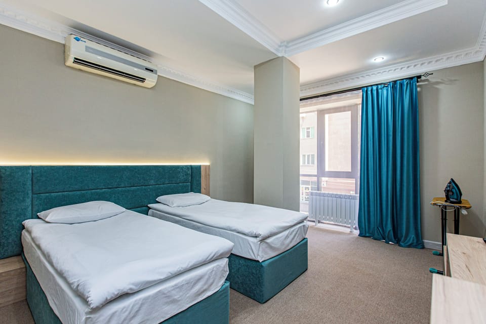 Deluxe Room, City View | 2 bedrooms, individually decorated, individually furnished, desk