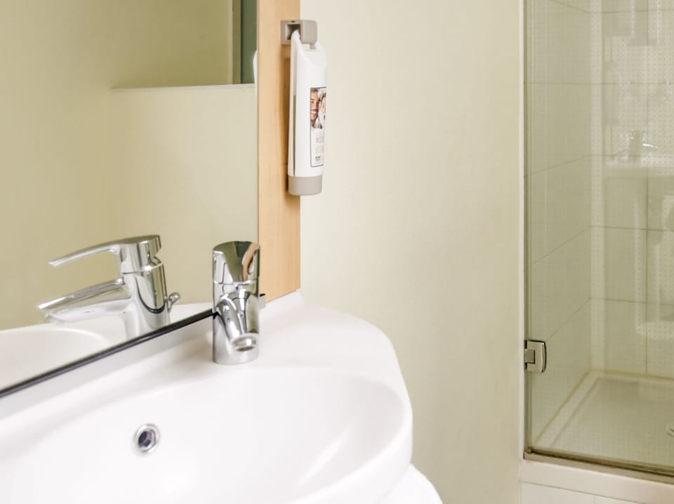 Shower, eco-friendly toiletries, hair dryer, towels