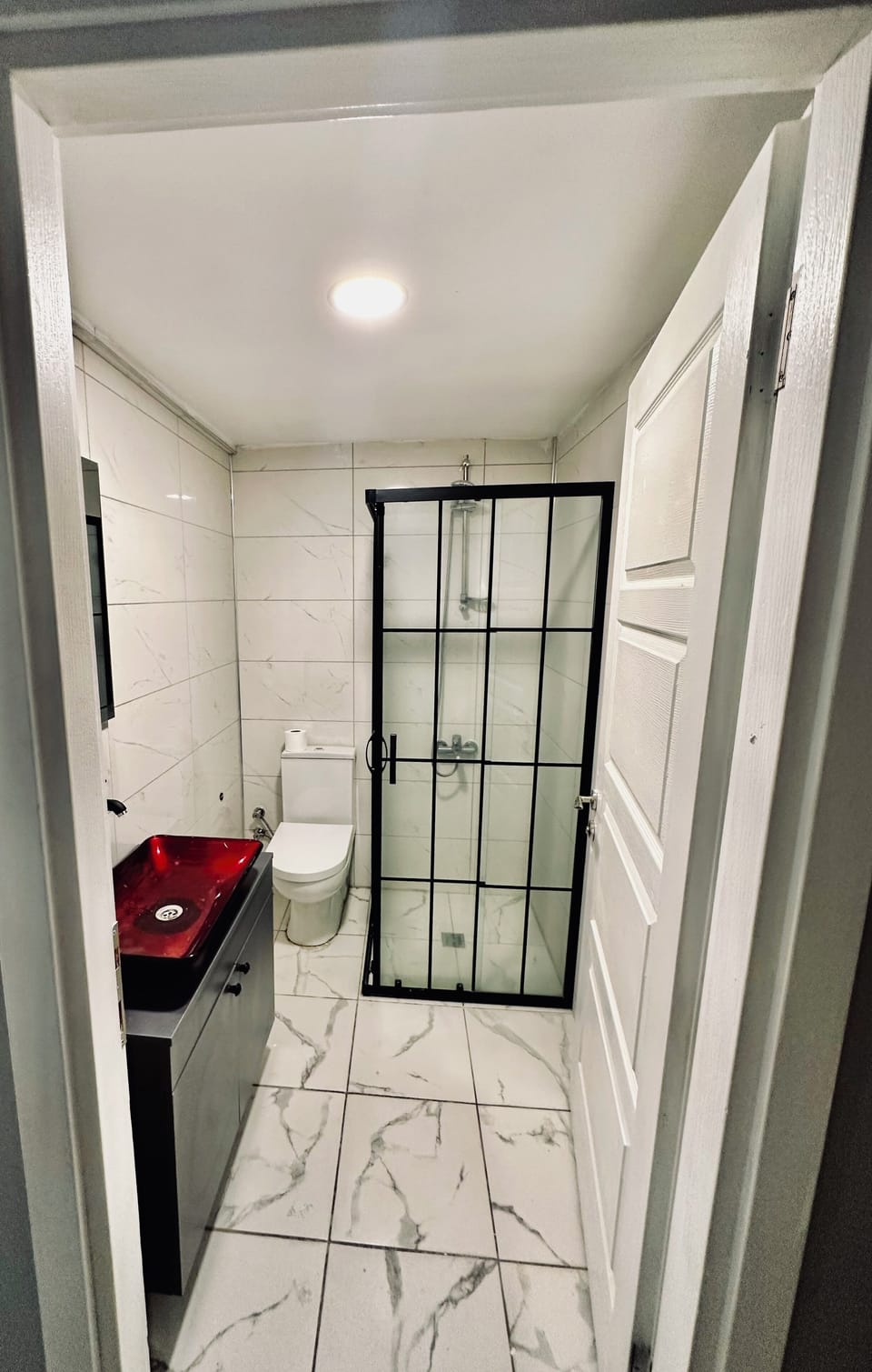 Shower, hair dryer, slippers, towels