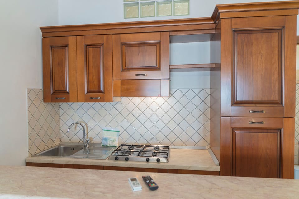 Studio, Garden View | Private kitchen | Full-size fridge, stovetop, highchair, cookware/dishes/utensils