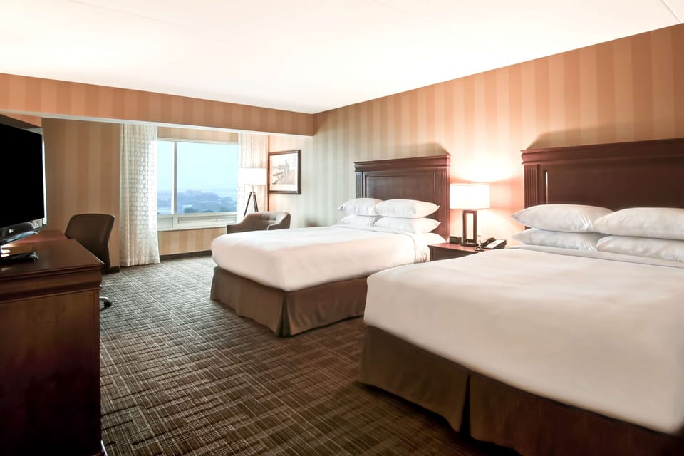 Premium bedding, down comforters, pillowtop beds, in-room safe