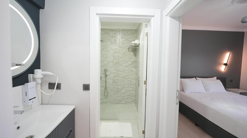 Shower, free toiletries, hair dryer, slippers