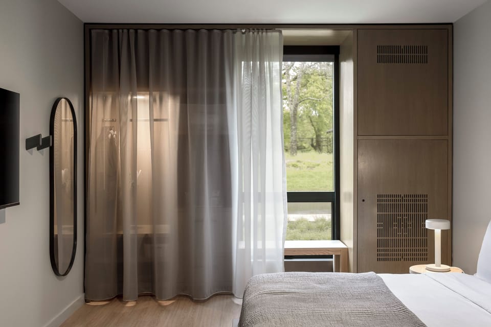 Premium bedding, down comforters, pillowtop beds, in-room safe