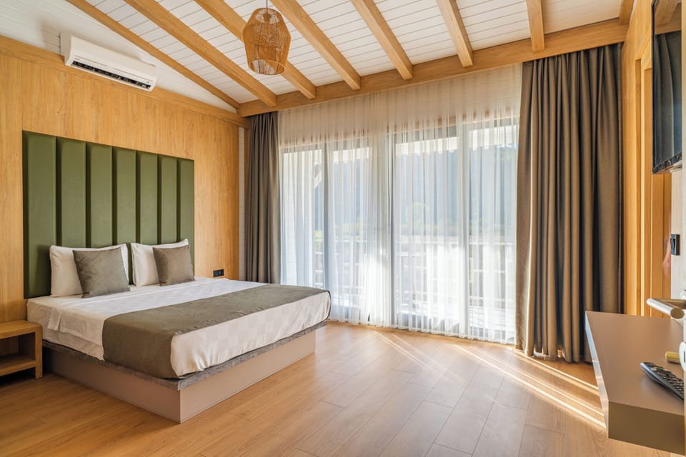 Family Apartment, Balcony, Garden View | Premium bedding, minibar, in-room safe, blackout drapes