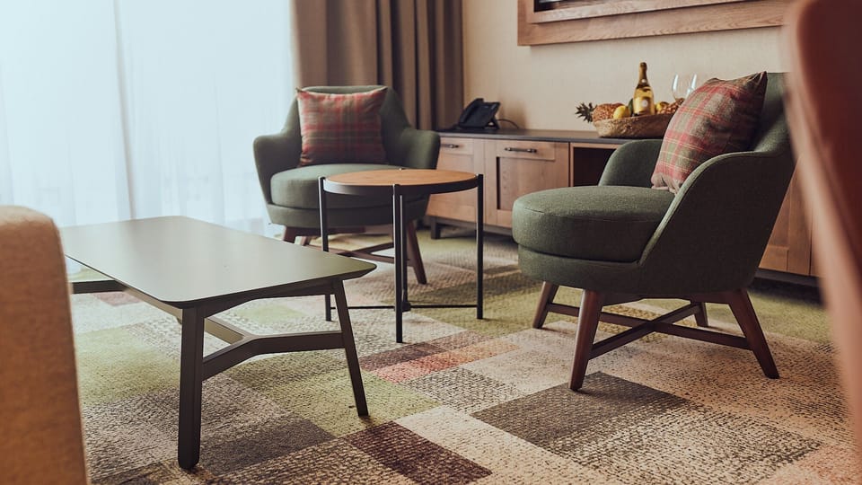 Deluxe Suite | Living area | 43-inch Smart TV with digital channels, Netflix, heated floors