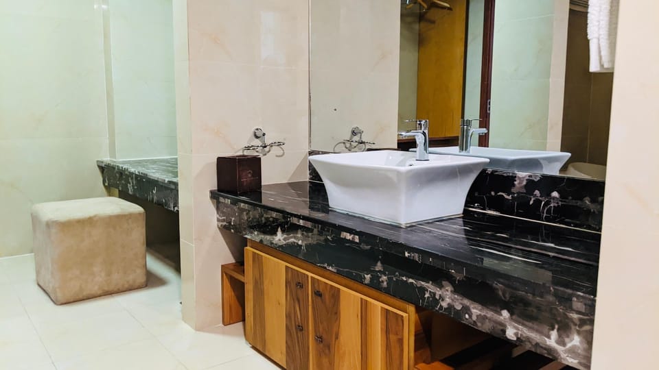 Suite, Non Smoking, Private Bathroom | Bathroom | Separate tub and shower, slippers, towels, soap
