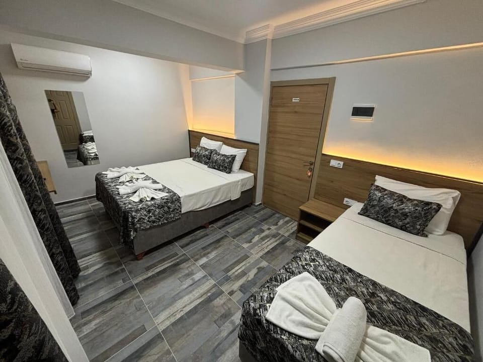 Classic Triple Room, Balcony, Garden View | Laptop workspace, soundproofing, free WiFi