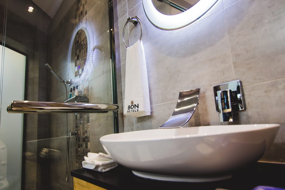 Superior Studio, City View | Bathroom | Shower, free toiletries, slippers, towels