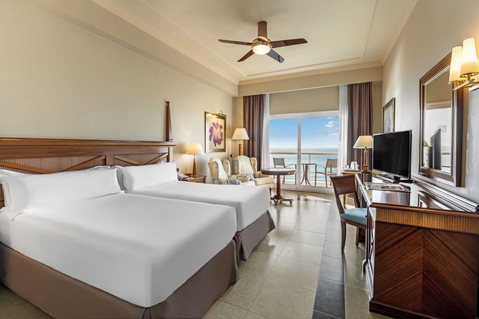 Premium bedding, down comforters, minibar, in-room safe