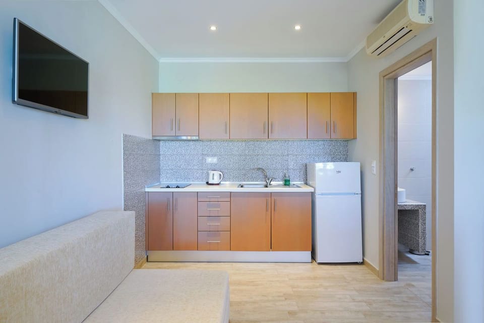 Classic Double Room, Partial Sea View | Private kitchen | Full-size fridge, stovetop, espresso maker, electric kettle