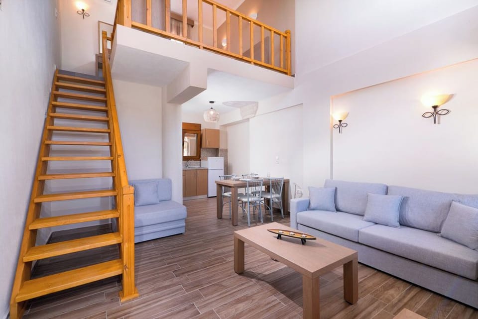 Deluxe Apartment, Kitchenette, Partial Sea View | Living area | 200-inch flat-screen TV with satellite channels