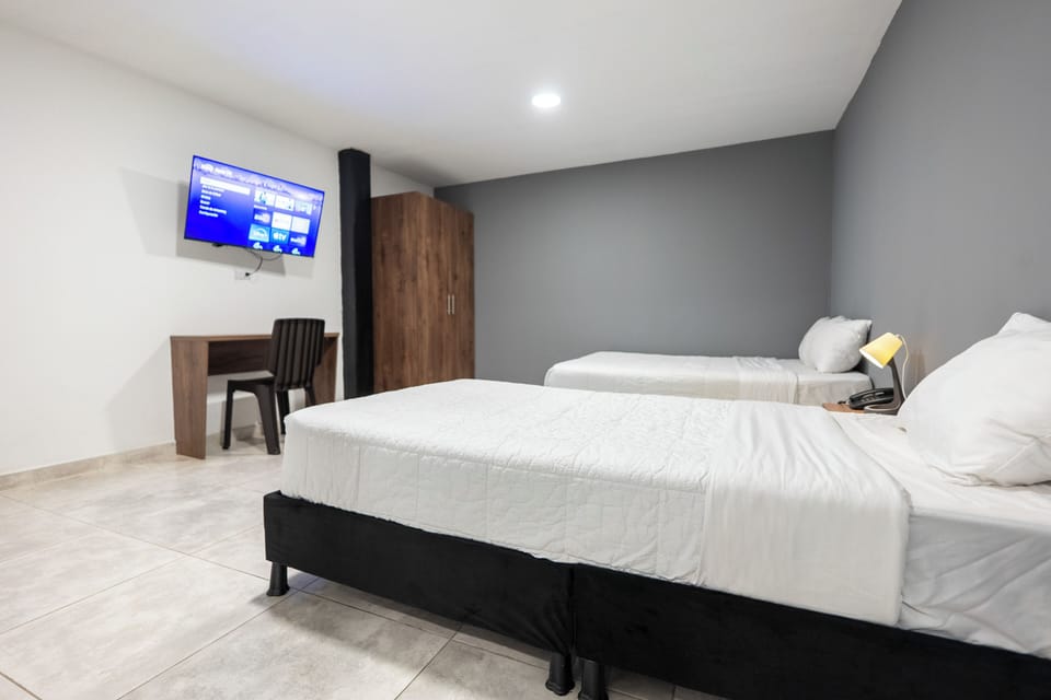 Family Twin Room | Desk, laptop workspace, WiFi (free), bed sheets