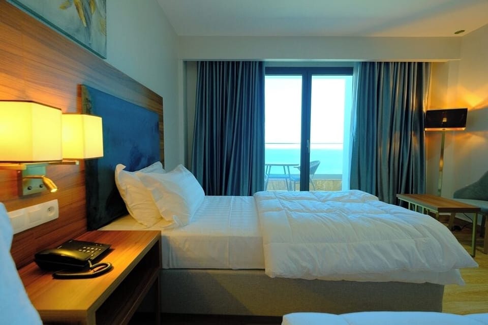 Classic Twin Room, Beach View | Desk, laptop workspace, soundproofing, iron/ironing board