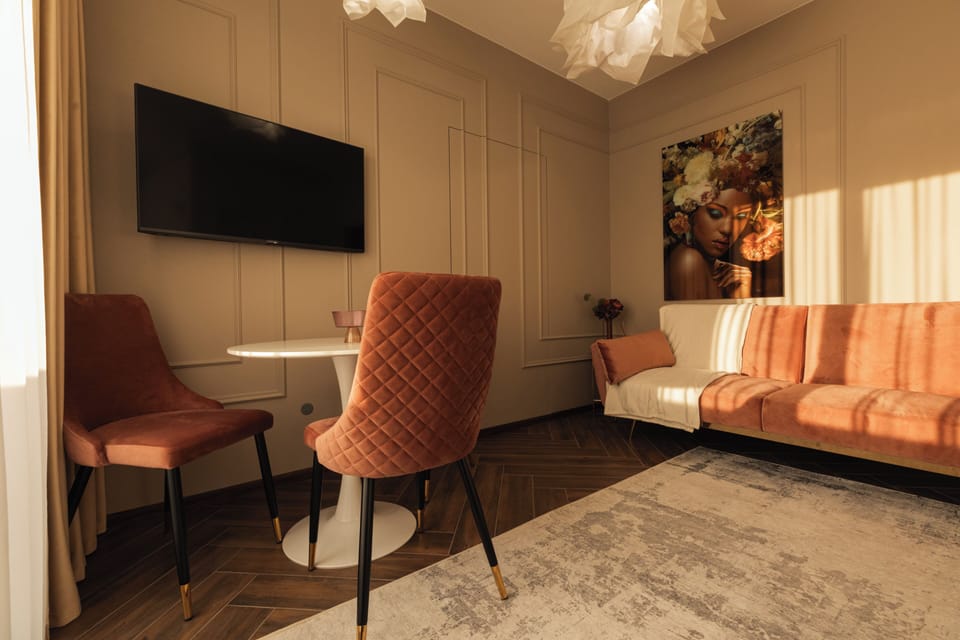 Deluxe Apartment, Balcony | Living area | Flat-screen TV
