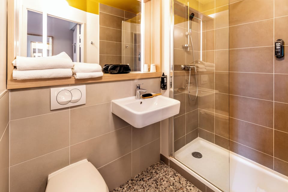 Shower, rainfall showerhead, towels, soap