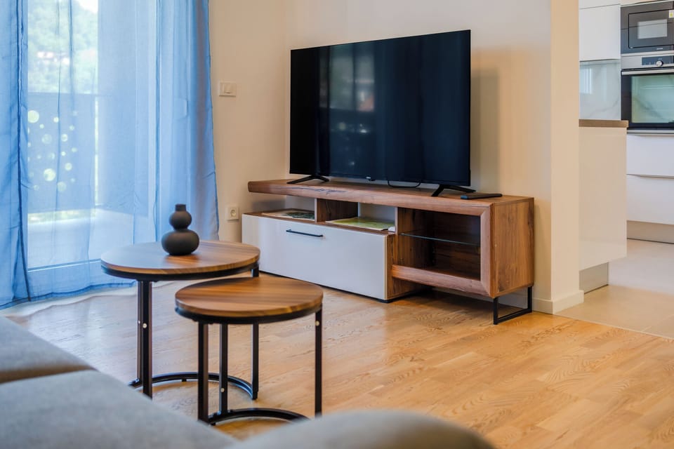 Family Apartment, 2 Bedrooms, Balcony (Modern Apartment With Balcony And) | Living area | Flat-screen TV
