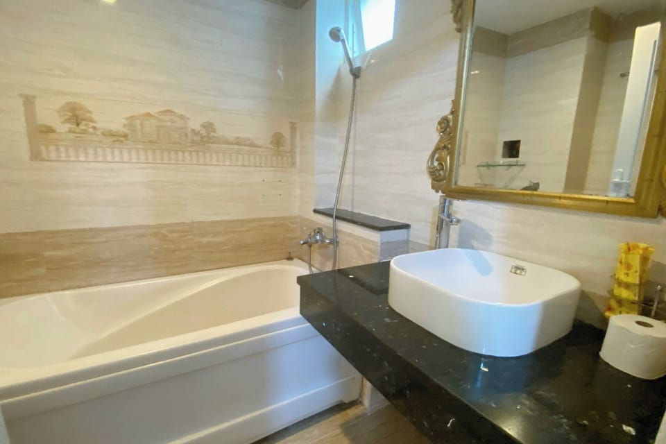 Designer toiletries, hair dryer, slippers, bidet