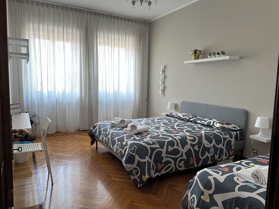 Family Triple Room, City View | Blackout drapes, free WiFi