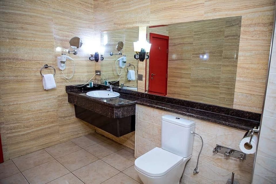 Bathtub, free toiletries, slippers, towels