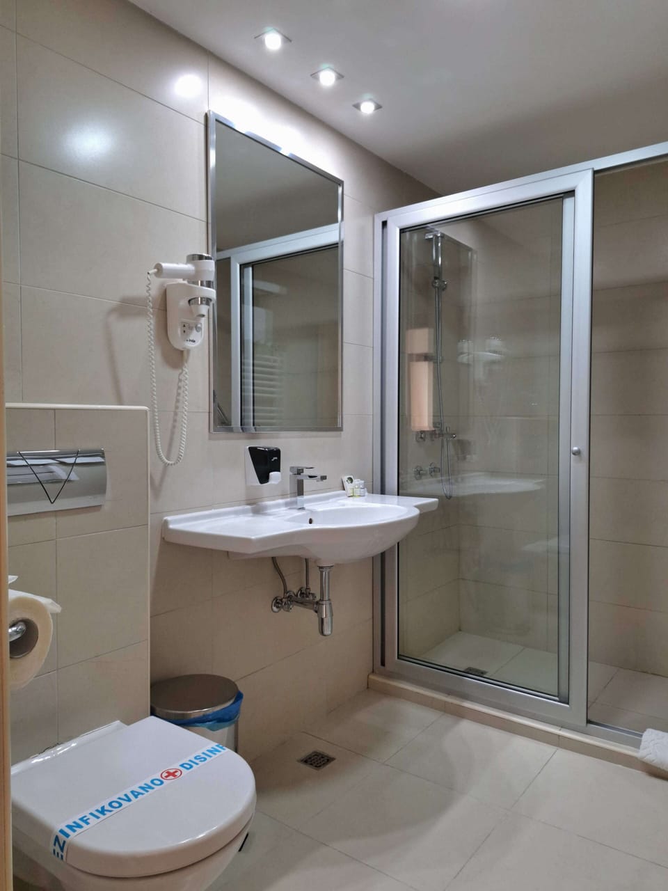 Shower, free toiletries, hair dryer, slippers