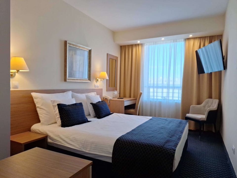 Superior Room | Desk, laptop workspace, blackout drapes, iron/ironing board