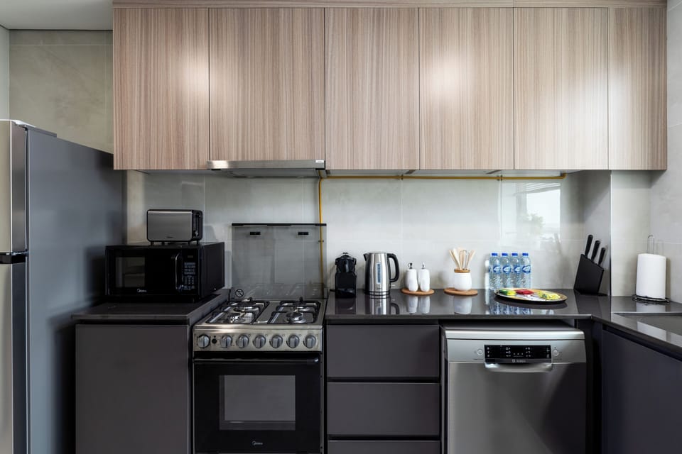 Comfort Apartment, Balcony | Private kitchen | Fridge, microwave, oven, stovetop