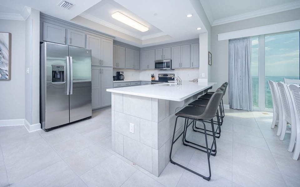 Condo, 4 Bedrooms | Private kitchen | Fridge, oven, coffee/tea maker