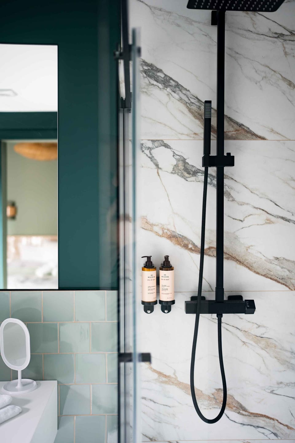 Shower, hair dryer, slippers, towels