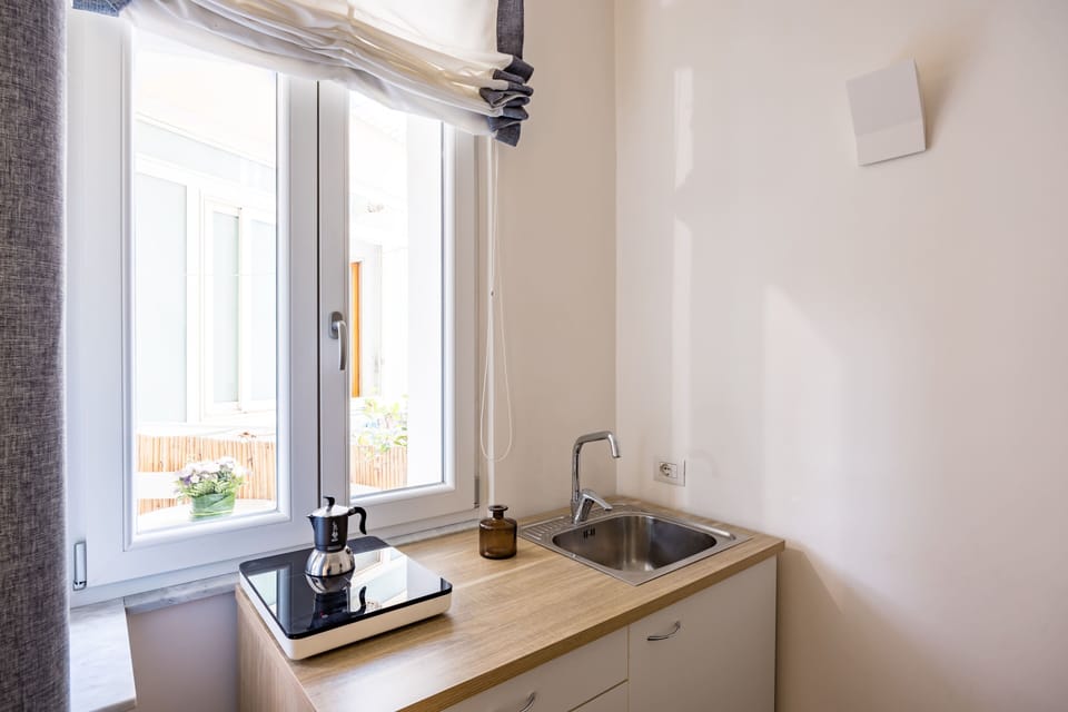 Triple Room, Balcony | Private kitchen