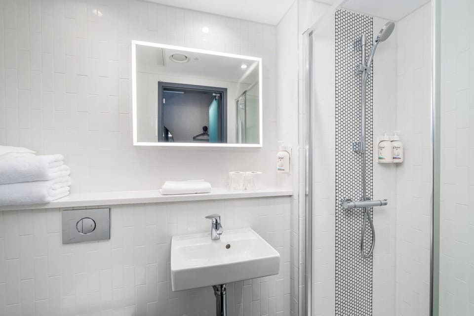 Shower, free toiletries, hair dryer, towels