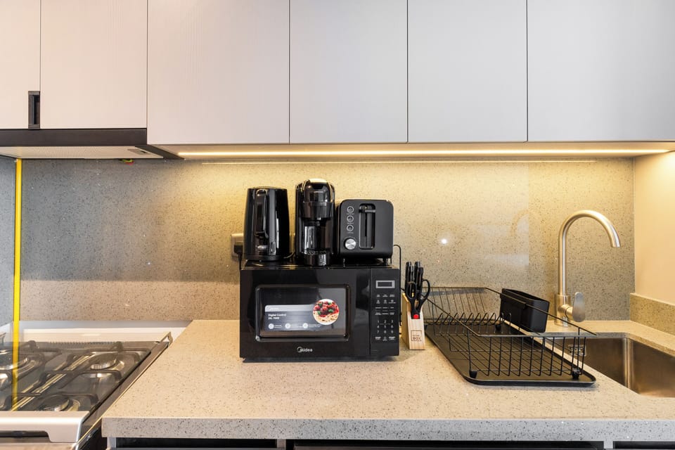 Standard Studio, Balcony, City View | Private kitchen | Fridge, microwave, oven, stovetop