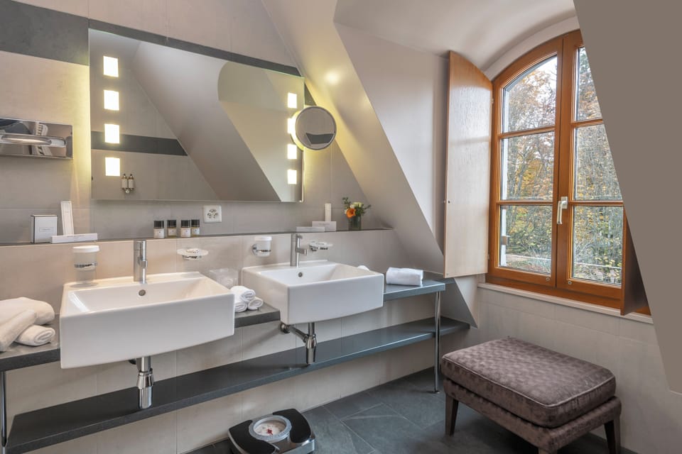 Designer toiletries, hair dryer, bathrobes, slippers