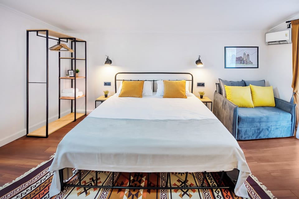 Triple Room, City View | Blackout drapes, iron/ironing board (on request), WiFi (free)
