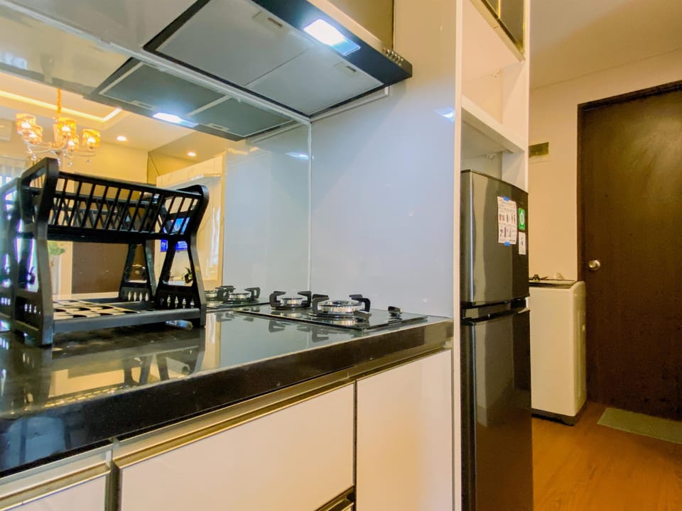 Apartment | Private kitchen | Full-size fridge, stovetop, rice cooker, dining tables