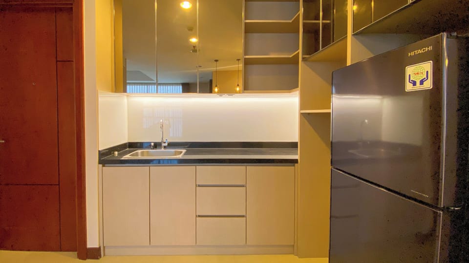 Apartment | Private kitchen | Fridge, stovetop, rice cooker, dining tables