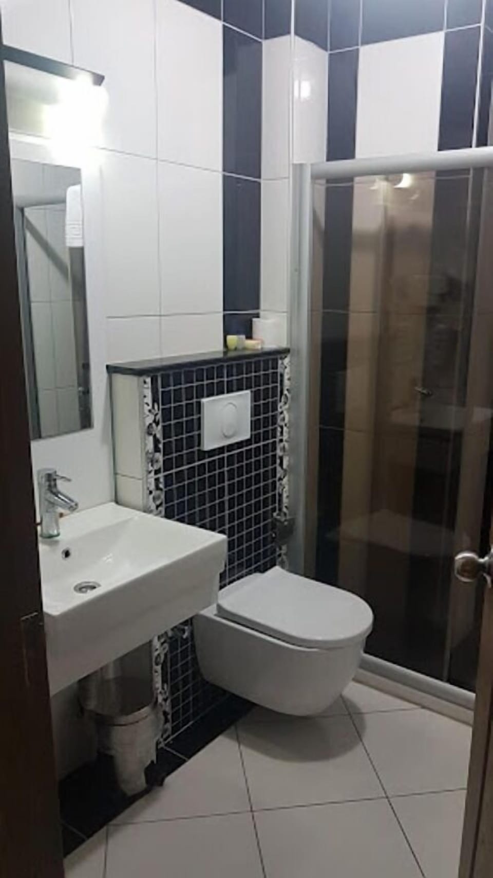 Shower, hair dryer, slippers, towels