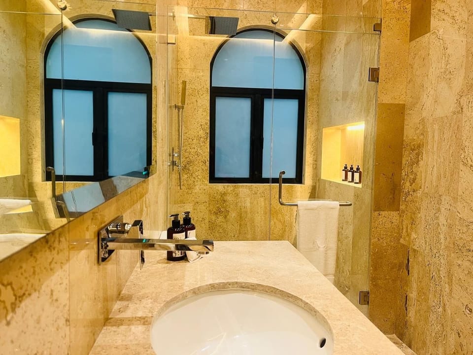 Grand Double Room, Courtyard View | Bathroom | Designer toiletries, hair dryer, slippers, heated floors