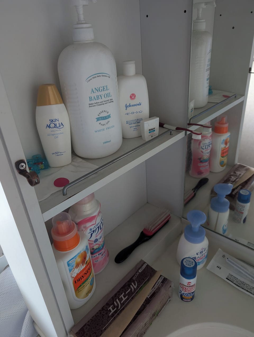 Combined shower/tub, hair dryer, slippers, soap