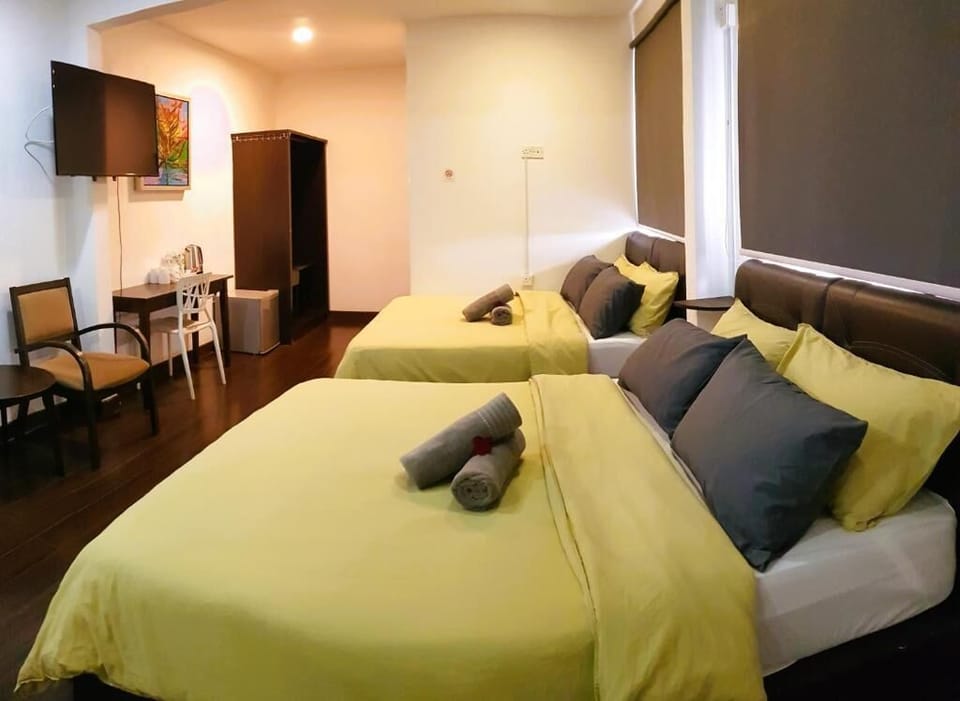 Family Quadruple Room, 2 Queen Beds, Mountain View | Minibar, desk, laptop workspace, iron/ironing board