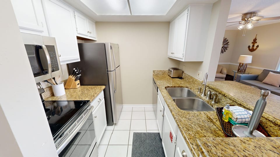 Condo, 1 Bedroom | Private kitchen | Coffee/tea maker, fridge, oven, stovetop