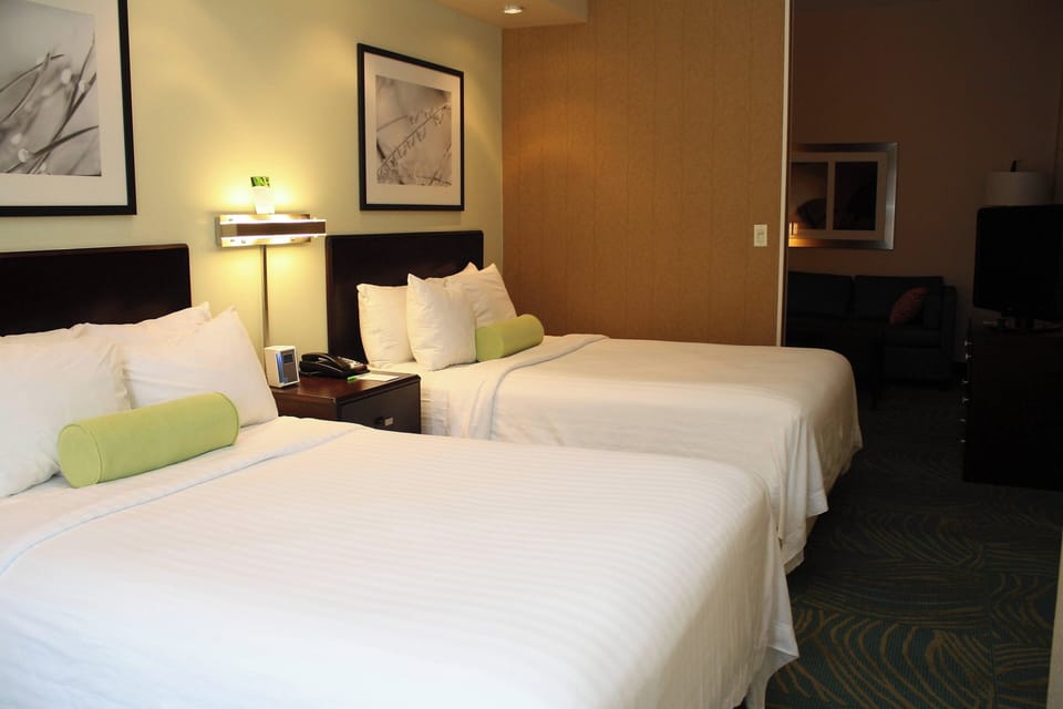 Suite, Multiple Beds | Pillowtop beds, in-room safe, desk, iron/ironing board
