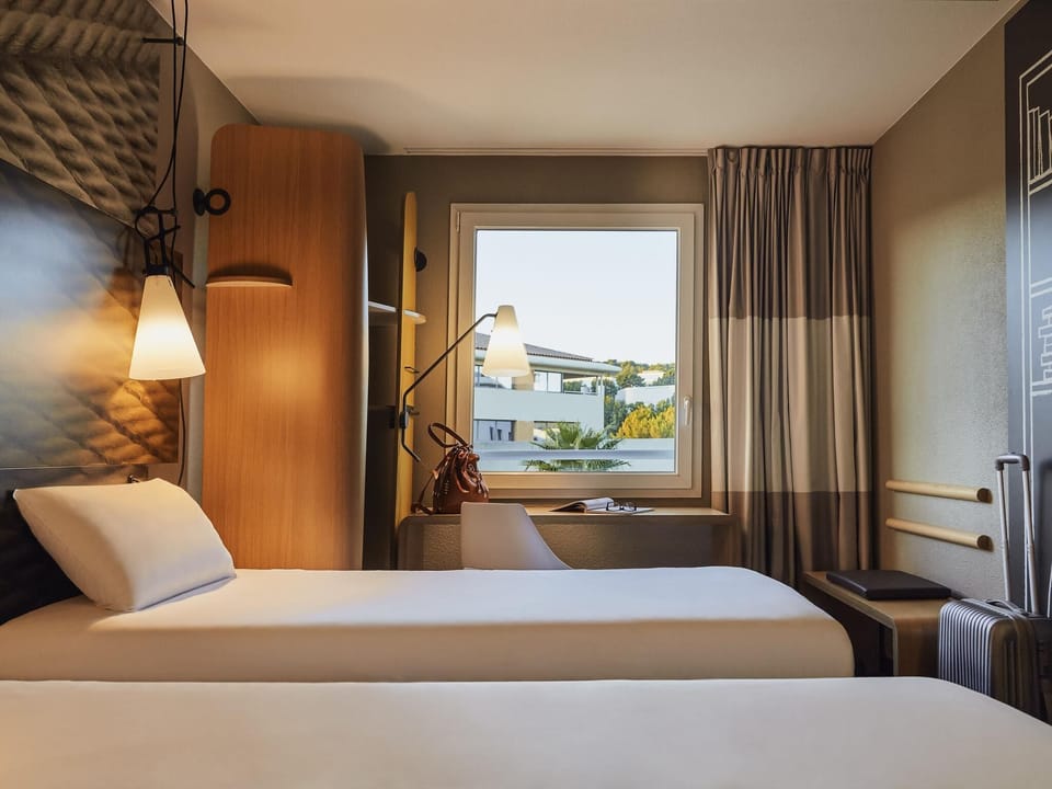 Premium bedding, pillowtop beds, desk, blackout drapes