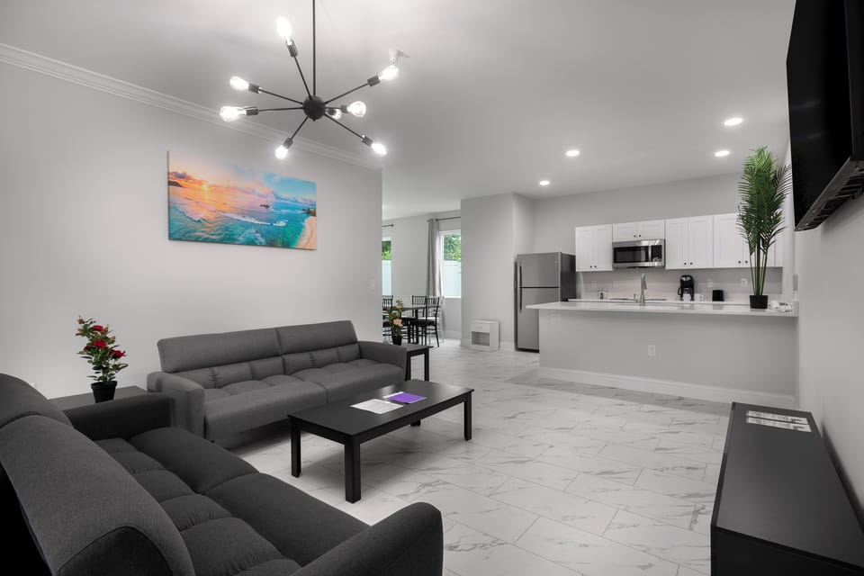 Condo, 4 Bedrooms | Living room | Flat-screen TV