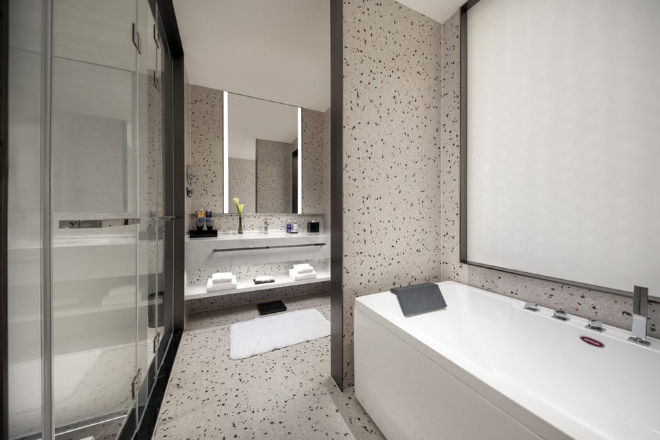 Suite, 1 Bedroom | Bathroom | Shower, rainfall showerhead, designer toiletries, hair dryer