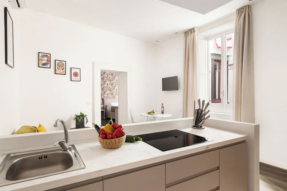 Deluxe Apartment, 2 Bedrooms | Private kitchen | Full-size fridge, microwave, stovetop, espresso maker