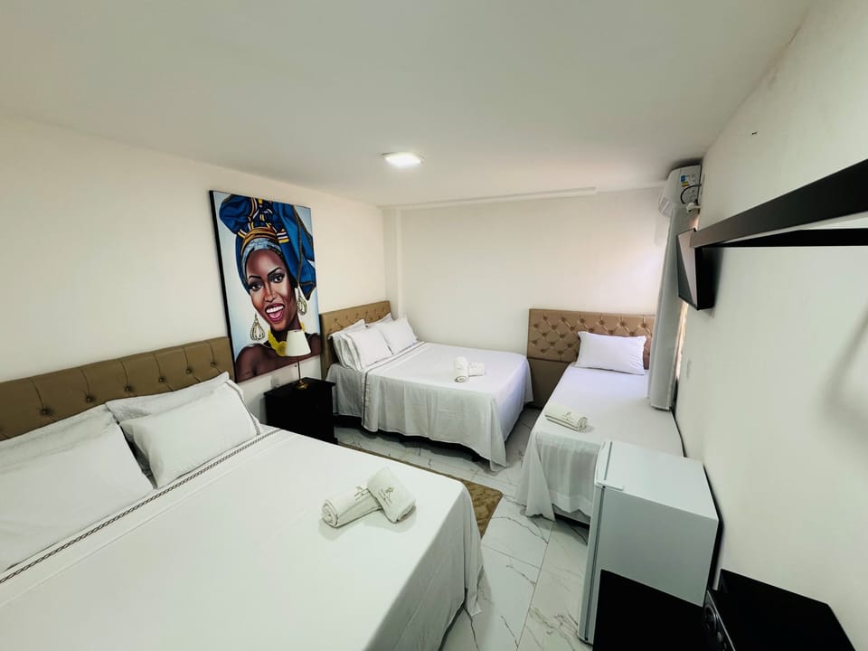 Luxury Quadruple Room, Courtyard View | Premium bedding, minibar, in-room safe, individually decorated