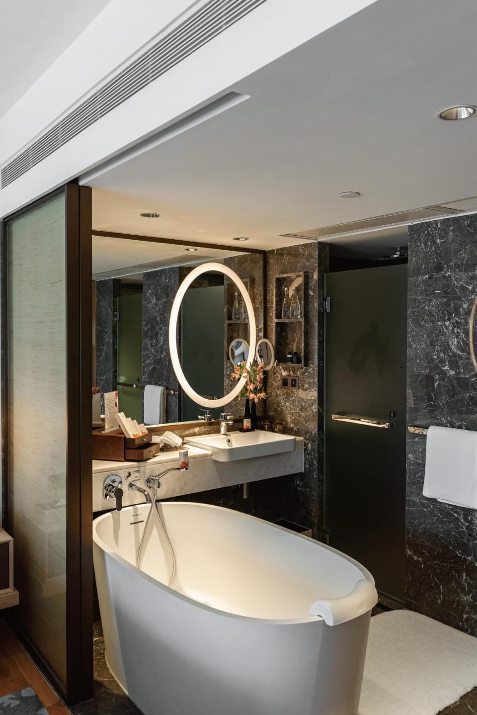 Separate tub and shower, rainfall showerhead, hair dryer, bathrobes