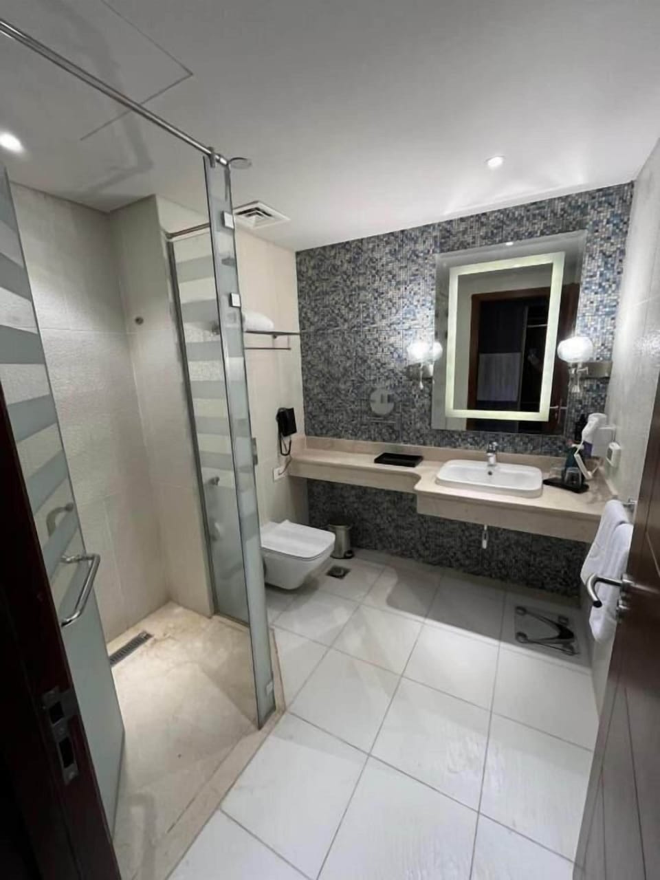 Combined shower/tub, hair dryer, towels, soap